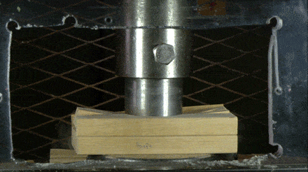 hydraulic press on wood planks